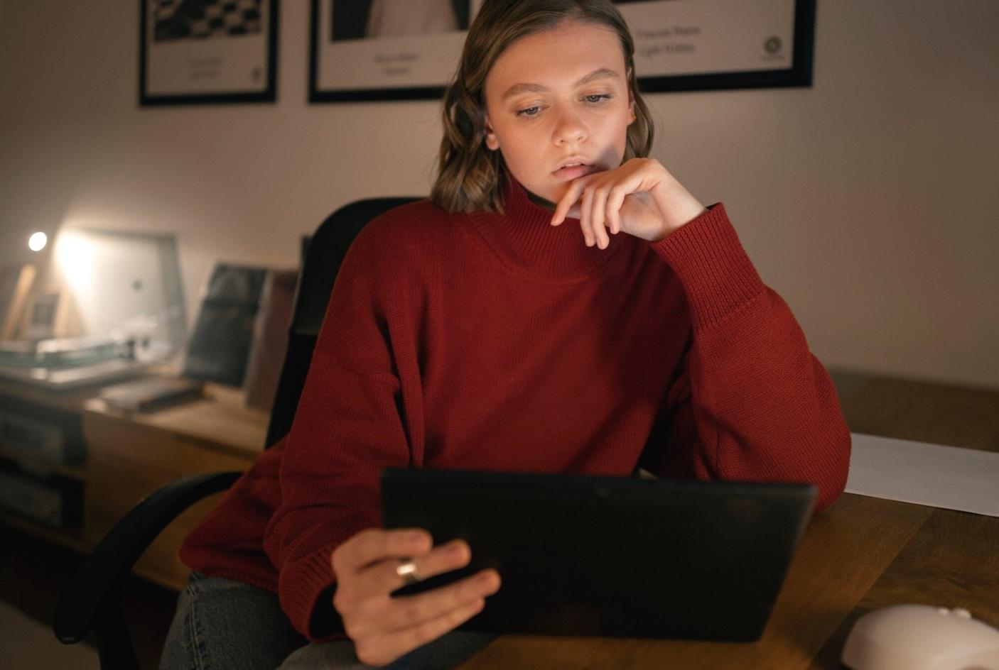 Professional consultation meeting room with financial documents and analysis charts displayed on modern screens